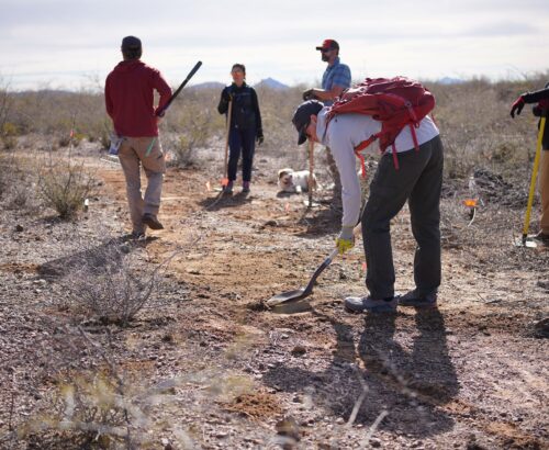trail work volunteers moving dirt