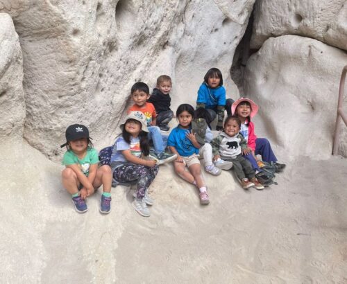 Group of children smiling at Bandelier National Monument